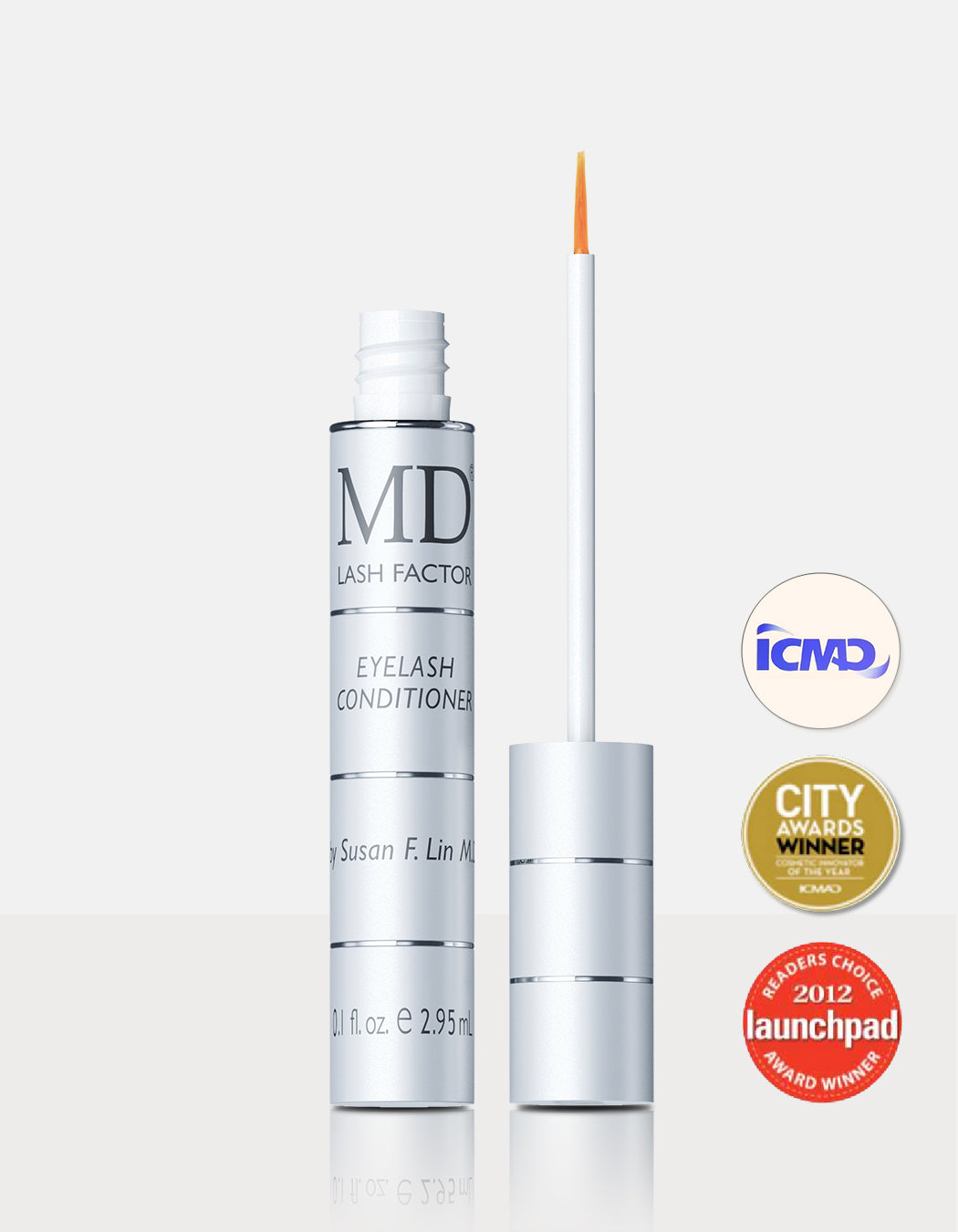 Precision applicator for MD Lash Factor® highlighting the ophthalmologist-tested formula safe for contact lens wearers and sensitive eyes.